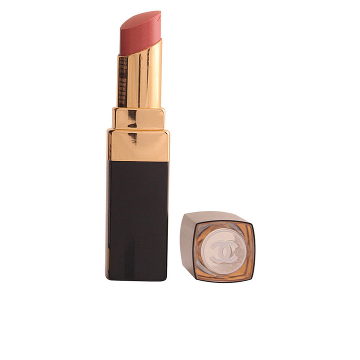 Sheer luminous lipstick stick in warm rose-brown shade, compact tube