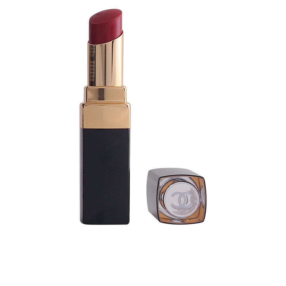 Garnet shade gel lipstick in sleek case, glossy finish visible