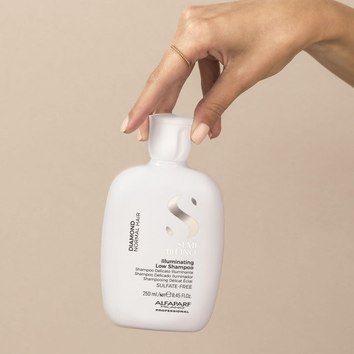250 ml clear bottle of lightweight illuminating shampoo with argan and linseed