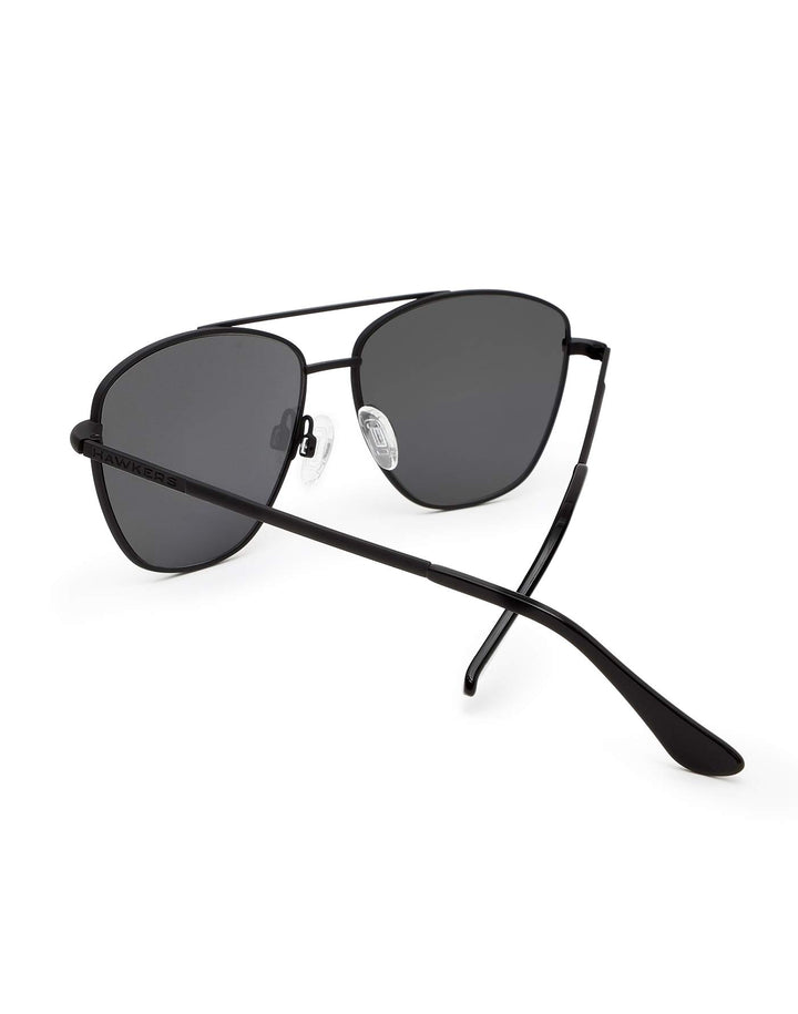 Hawkers Black metal aviator sunglasses with double bridge, dark tinted lenses, adjustable nose pads, slim temples