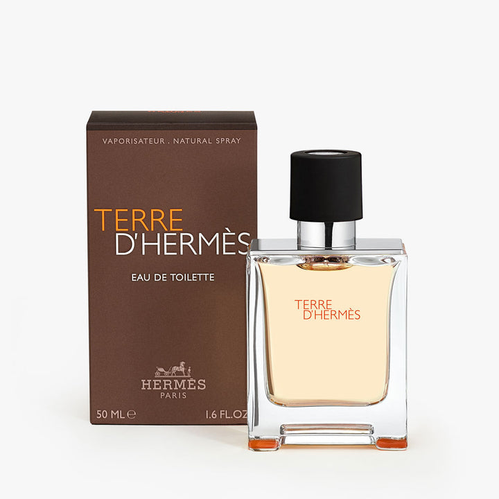 Clear glass bottle with metal shoulders, 50 ml eau de toilette, woody-citrus fragrance