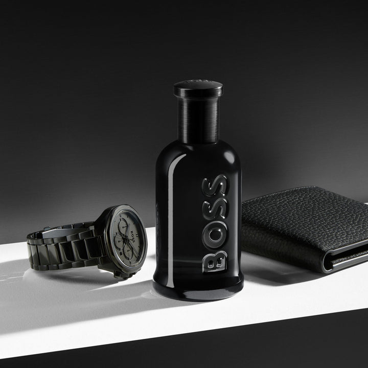 50 ml clear bottle of woody amber eau de parfum for the Man, amber liquid