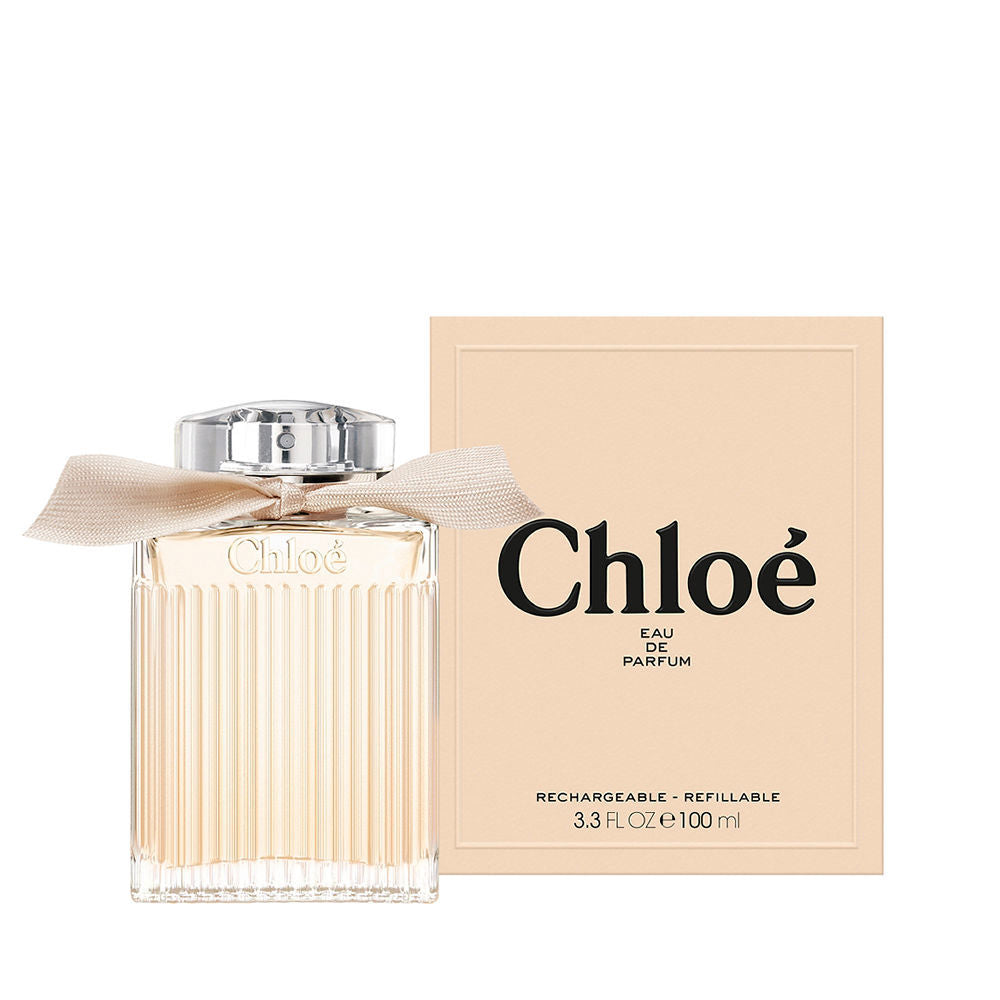 Clear glass 100 ml perfume bottle with soft blush liquid, floral-oriental fragrance