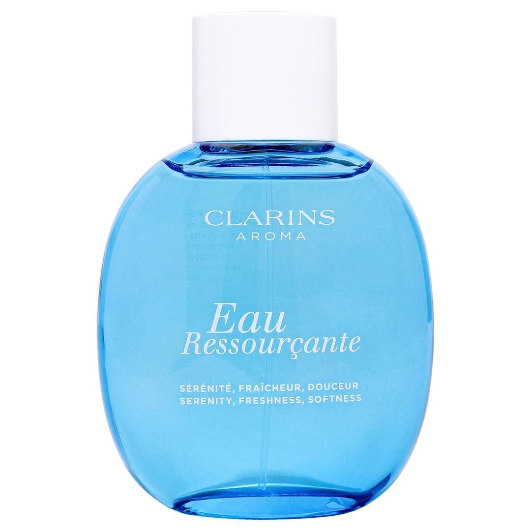 Dark blue elegant perfume bottle labeled Eau Ressourçante, floral-woody fragrance