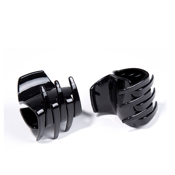 Inca Black mid-size plastic hair claw with curved prongs, glossy finish, open claw design, spring hinge