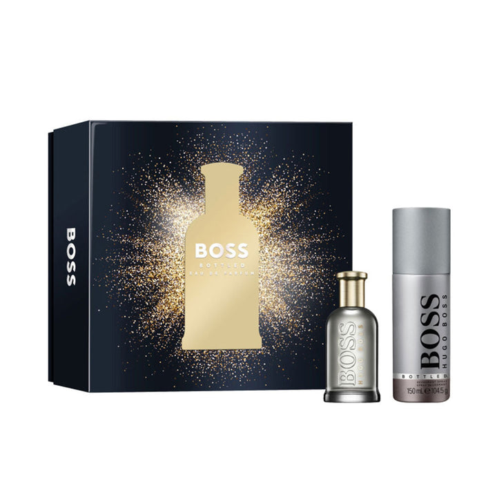 Fragrance gift set with eau de toilette and toiletry in pared‑back gift case, woody‑fruity scent