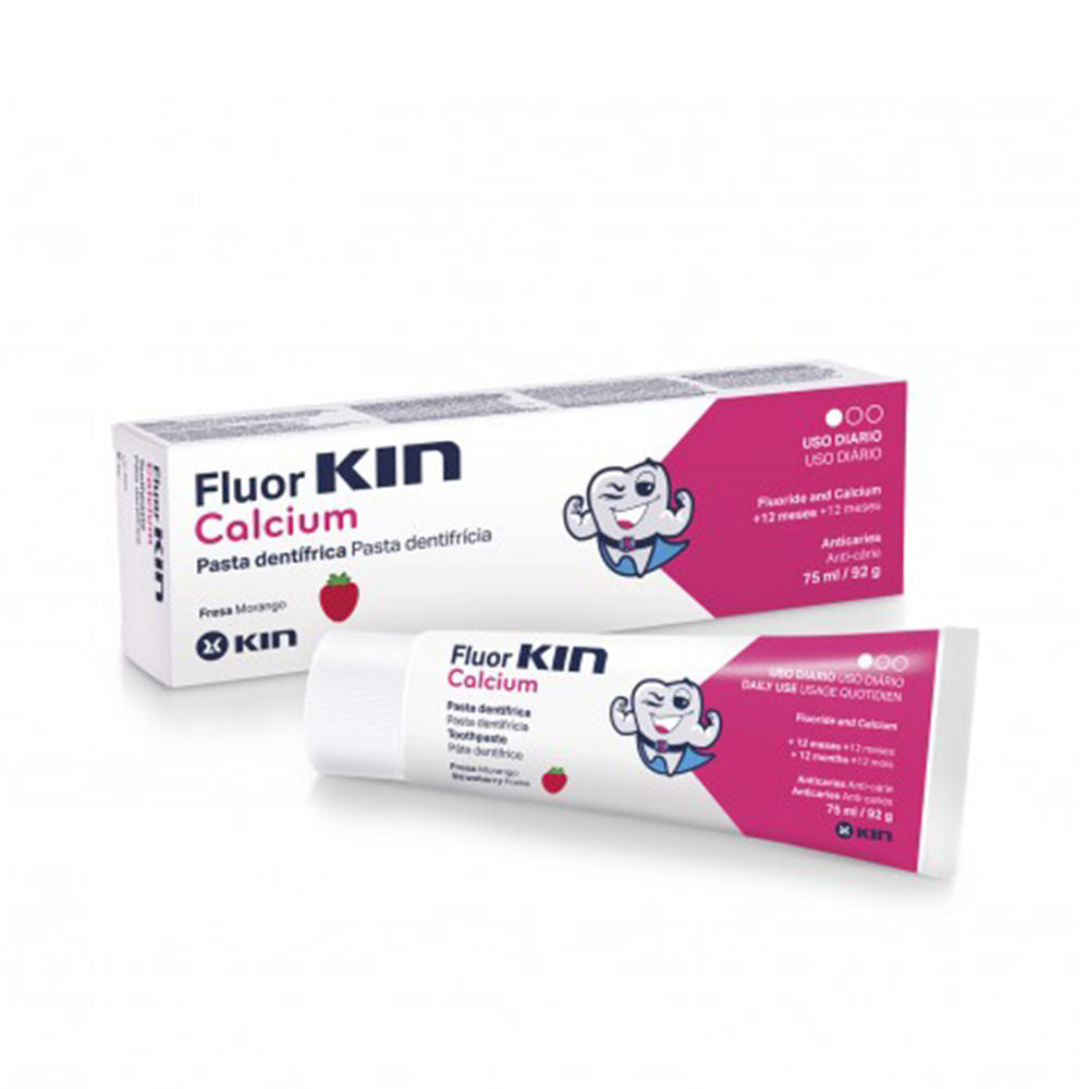 Kin White and pink plastic toothpaste tube with cartoon tooth, strawberry icon, blue accents, and boxed packaging