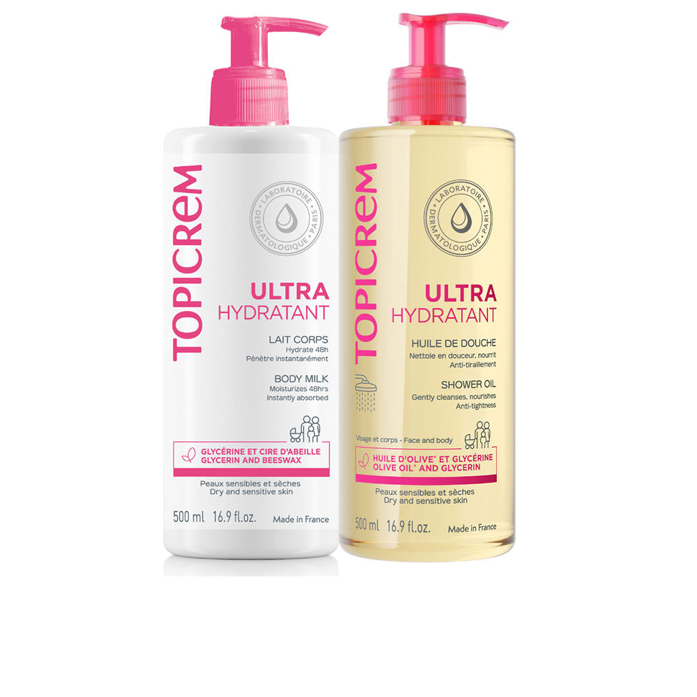 Topicrem Two plastic body milk and shower oil bottles, white and light yellow, pink pump caps, pump dispensers, vertical bilingual text, water‑drop logo visible