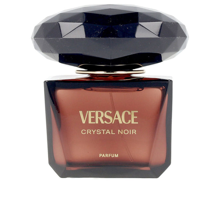 50 ml clear glass perfume bottle with amber-hued liquid, elegant stopper