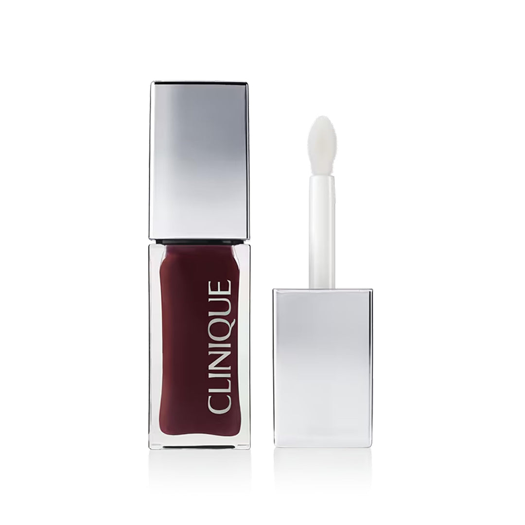 Clinique Warm garnet lip and cheek oil in sleek glass bottle with tapered applicator, polished minimalist design