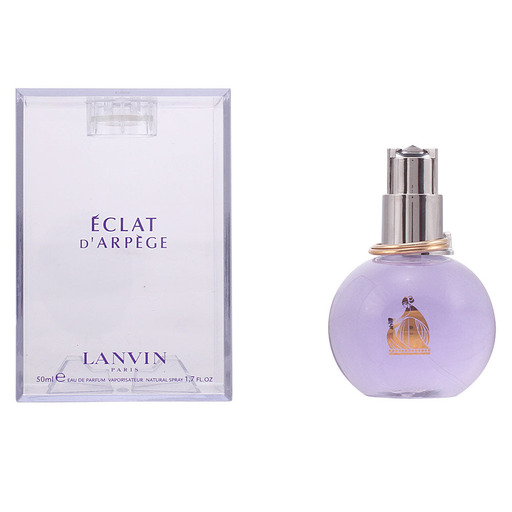 Curved Art‑Déco perfume bottle, pale violet liquid, silver double‑ring cap, 50 ml