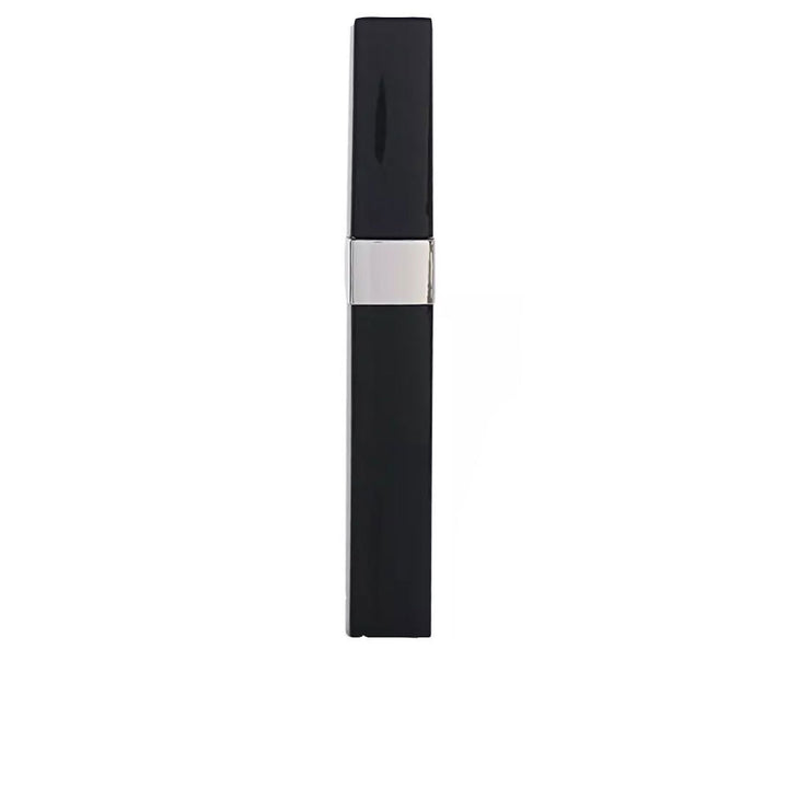 Black rectangular tube with silver middle band and smooth surface, wand beside tube, brand Chanel