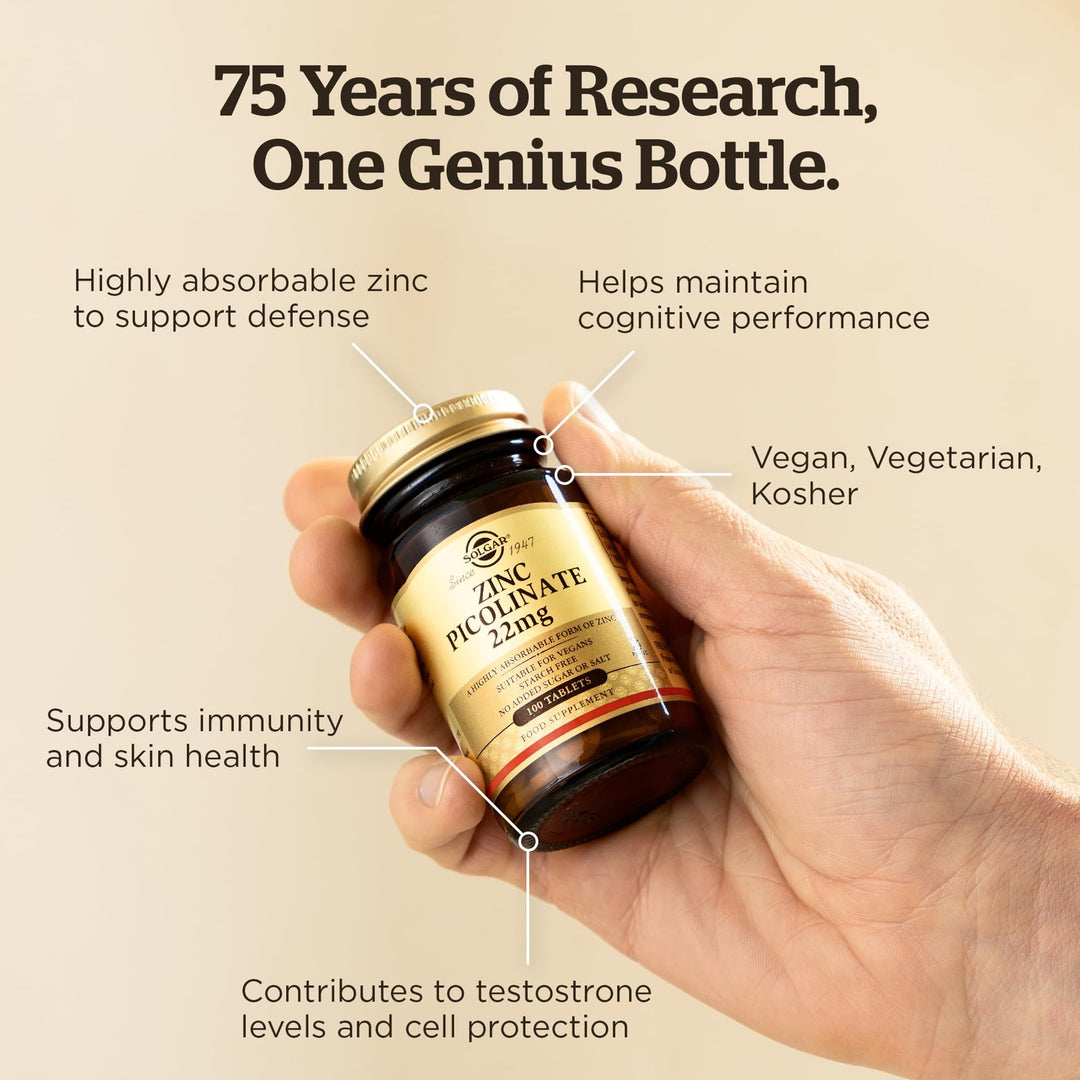 Solgar Amber glass supplement bottle with gold screw cap, beige label with black and gold text, classic apothecary style