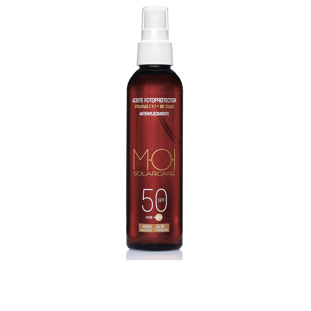Moi Deep red cylindrical sunscreen spray bottle with gold and white text, visible spray nozzle and SPF 50 label
