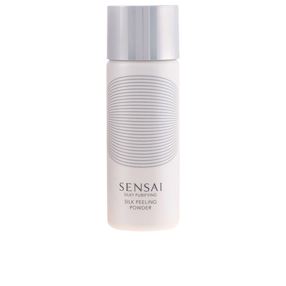 White and silver cylindrical powder bottle in minimalist plastic with striped circular design, Sensai.