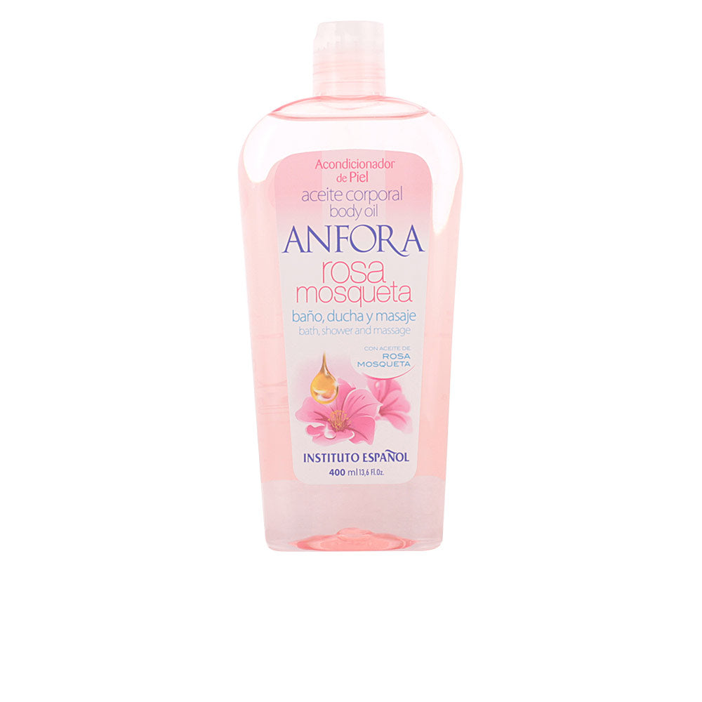 Instituto Español Transparent pink plastic bottle of rosehip body oil with flip-top cap, visible liquid and floral label