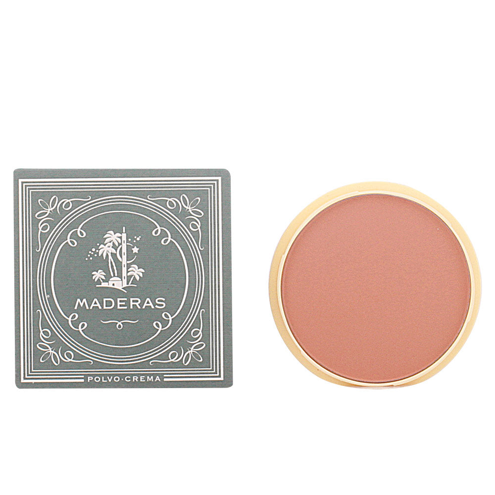 Maderas Warm brown powder-cream blush in round gold-rim compact beside decorative palm-print box, text visible