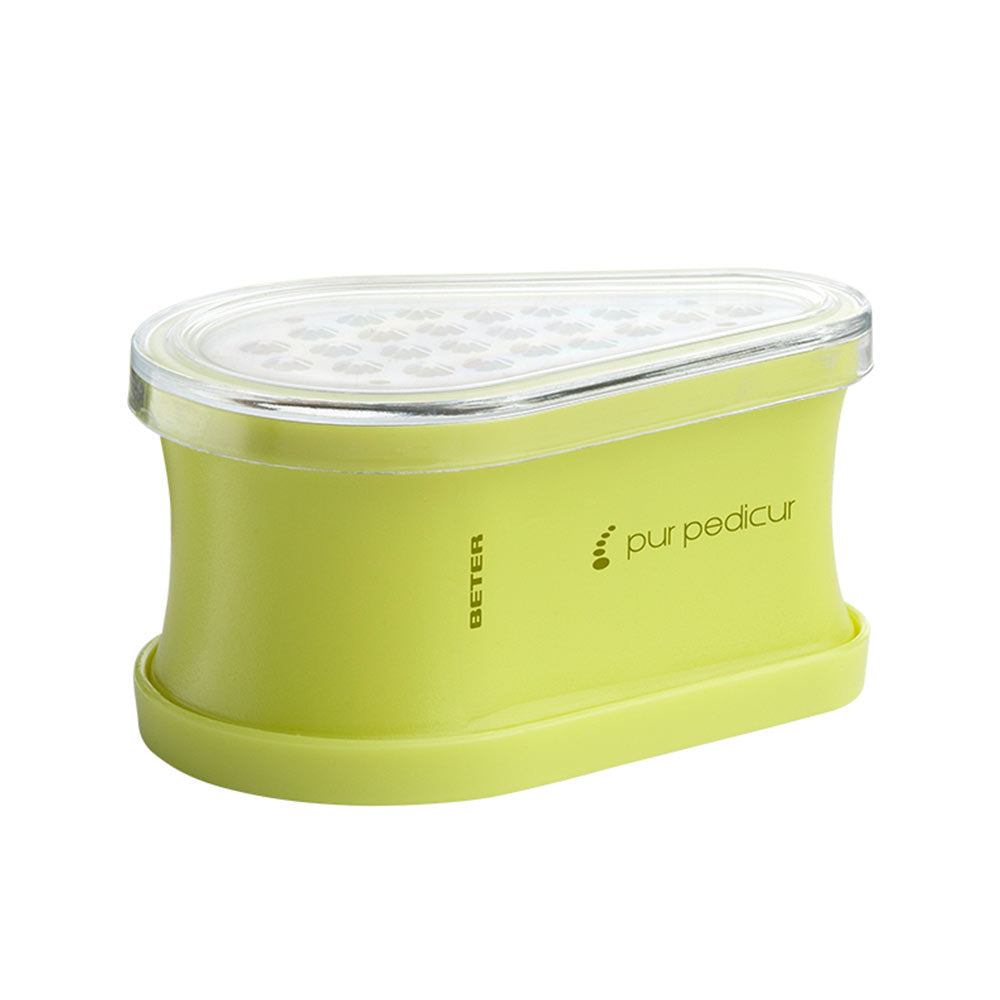 Light green plastic pedicure tool with transparent lid, curved shape, and integrated reservoir — Beter