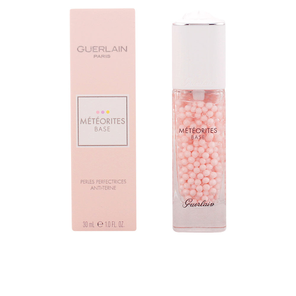 Guerlain Glass rectangular primer bottle with small pink spheres, white cap with silver rim, printed text, matching box