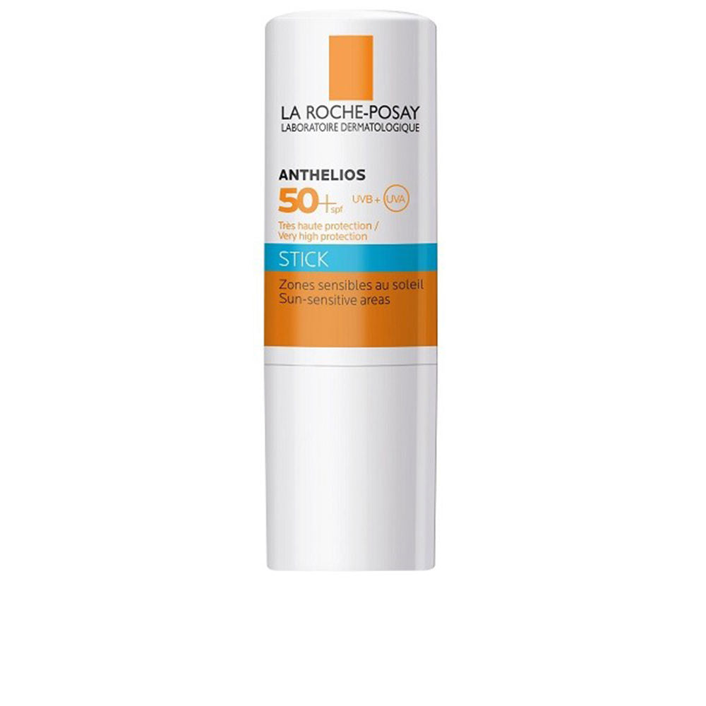 White, orange, and blue plastic sunscreen stick with protective cap, minimalist clinical design, la Roche Posay