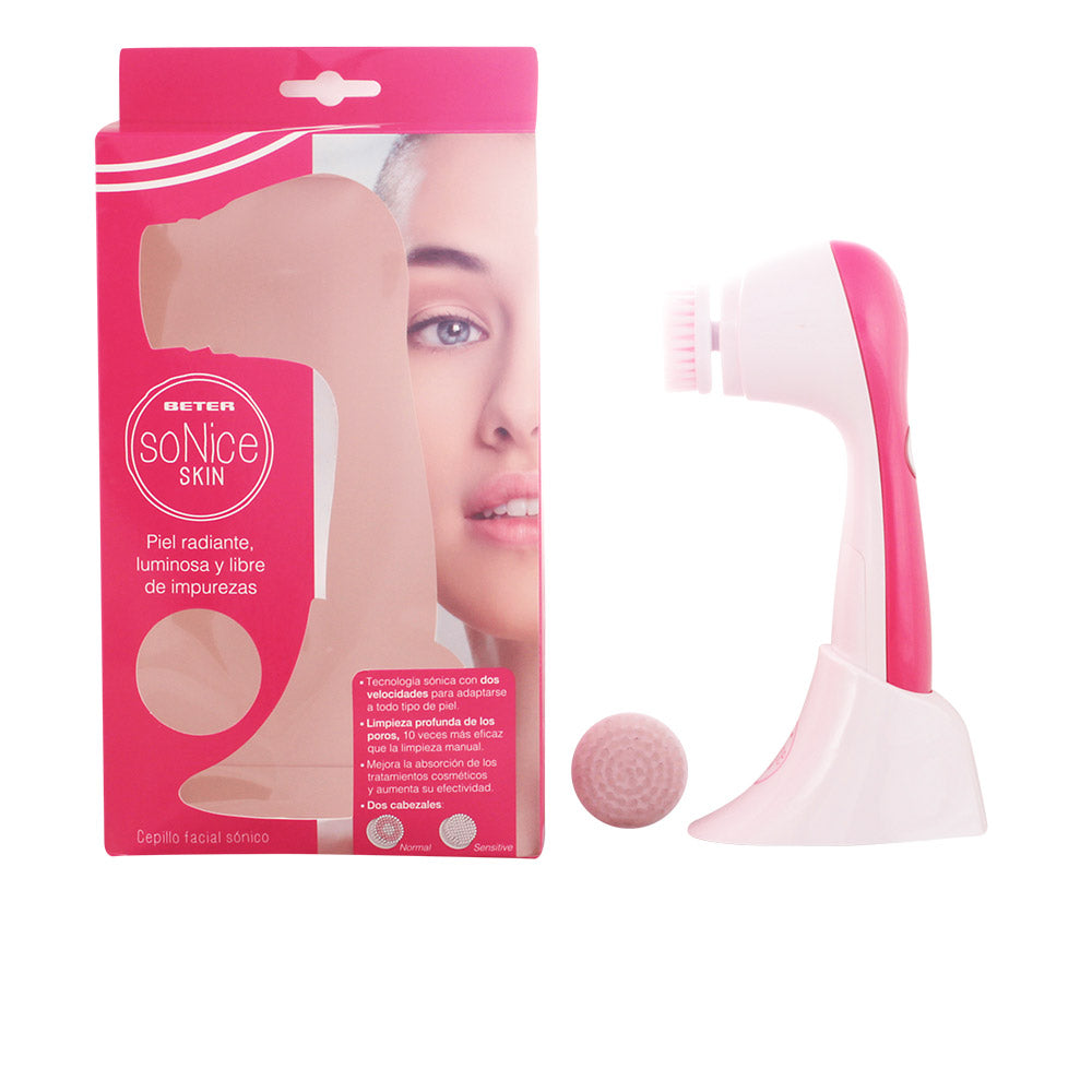 Beter White and pink plastic facial cleansing brush with ergonomic handle, brush head, charging stand