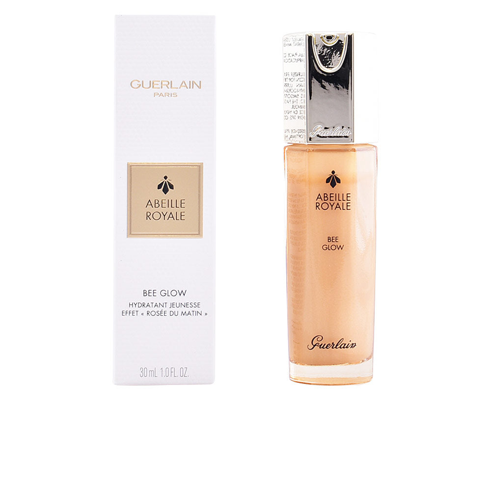Beige and white rectangular glass bottle with silver pump dispenser beside box, Guerlain visible