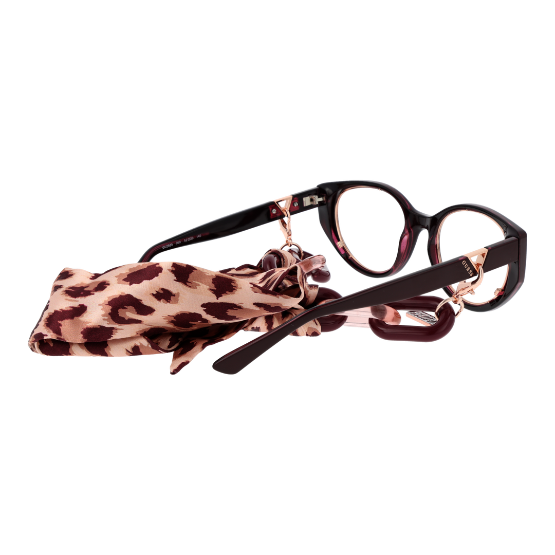 Dark burgundy cat-eye eyeglasses with rose-gold temples, chain detail, beige patterned attached scarf
