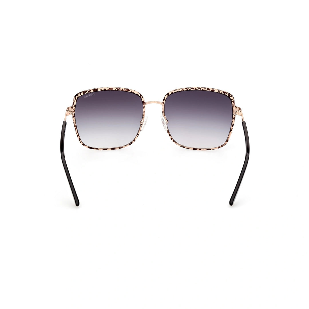 Beige and black patterned square sunglasses with gradient lenses and gold accents on a white background