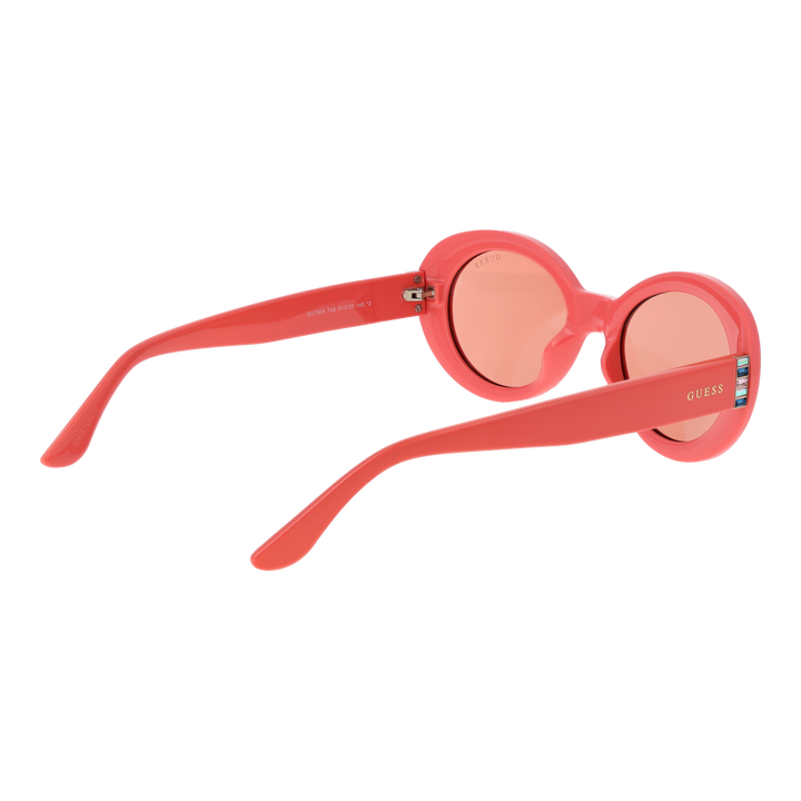 Pink retro oval sunglasses with decorative stones on temples and glossy plastic frame, angled view
