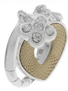 Silver ring with flower motif set with clear stones inside glossy beige-black jewelry box
