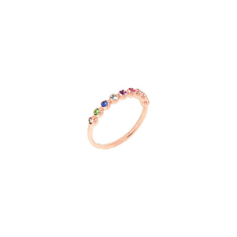 Rose gold stacking ring with multicolored pavé gemstones in blue green pink purple and clear stones