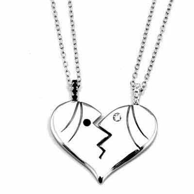Silver split heart pendant on two chains; one face with crystal eye, other with black eye detail