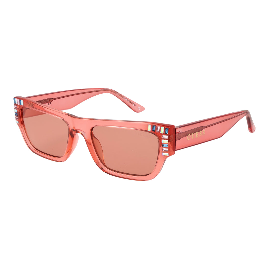 Translucent pink rectangular Guess sunglasses with decorative stones on corners and UV400 lenses on white background