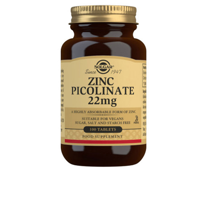 Solgar Amber glass supplement bottle with gold screw cap, beige label with black and gold text, classic apothecary style